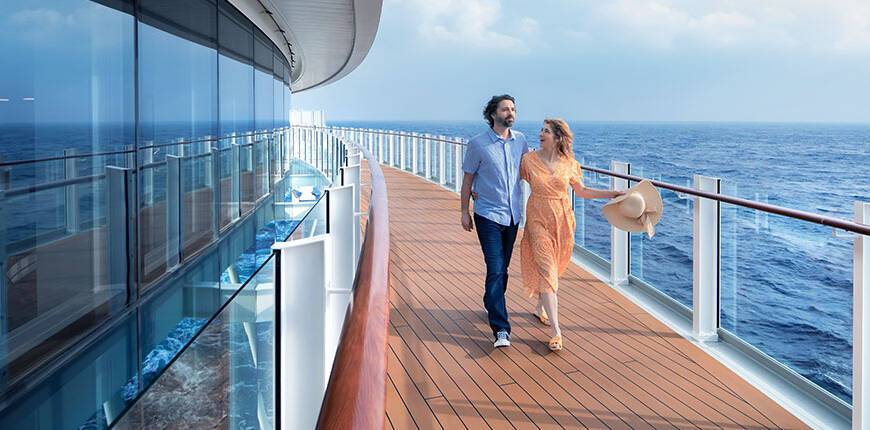 A couple walking along the deck of P&O Cruises' ship Iona