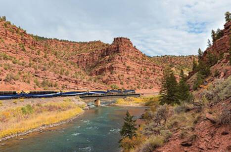 Rocky Mountaineer travelling through the Red Canyon