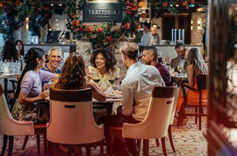 A group of friends dining in Sabatini’s Italian Trattoria