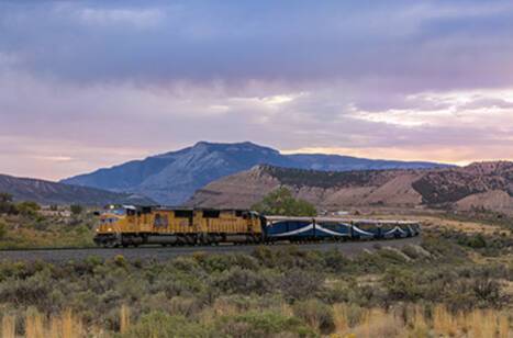 Rocky Mountaineer travelling at dusk