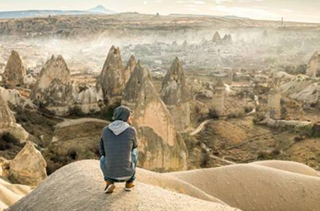 Solo traveller looking out over a landscape