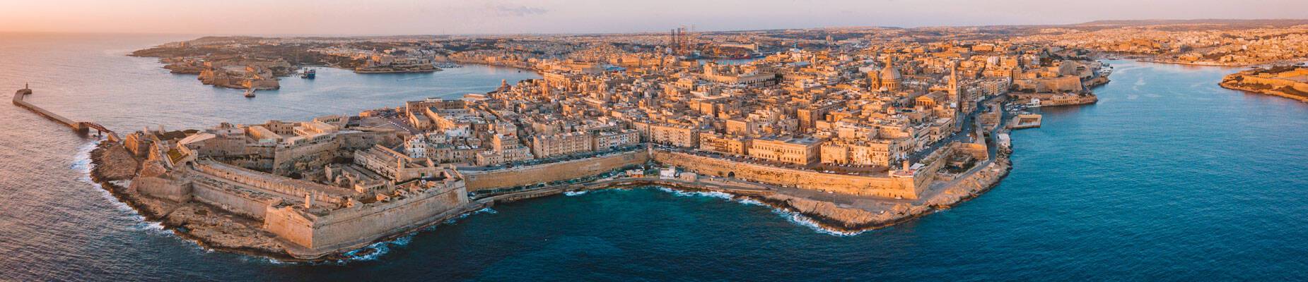 A panoramic image of Valletta, Malta, at sunset