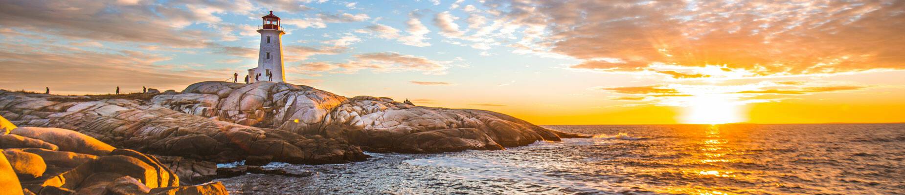 Panoramic image of Peggy’s Cove lighthouse at sunset in Halifax, Nova Scotia, Canada