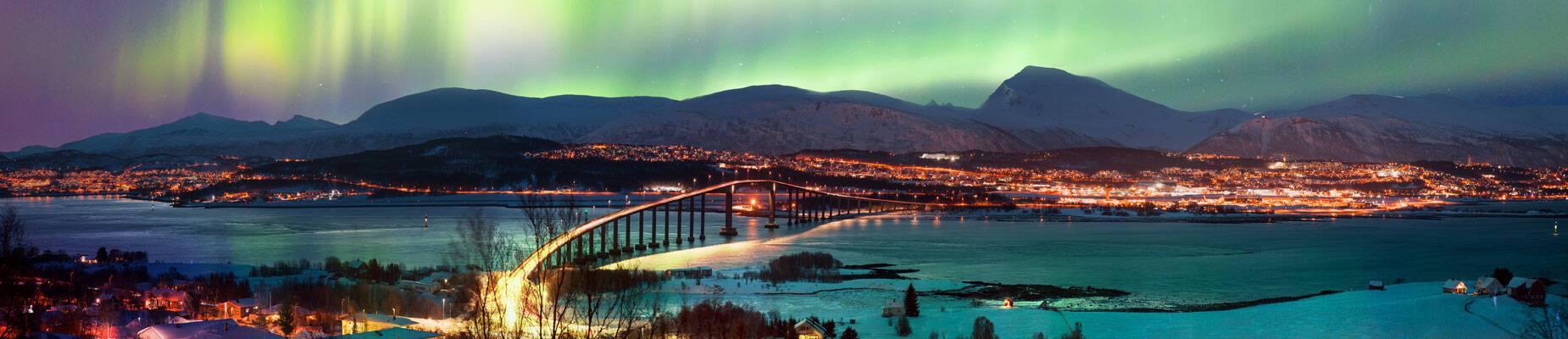 Panoramic image of the Northern Lights in the sky over Tromso, Norway