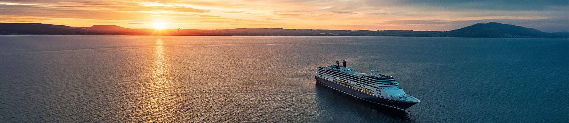 Borealis at sea during sunset