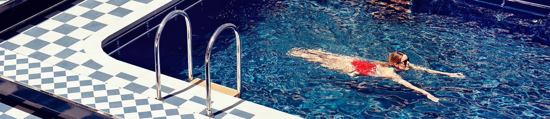 A woman swimming in a pool