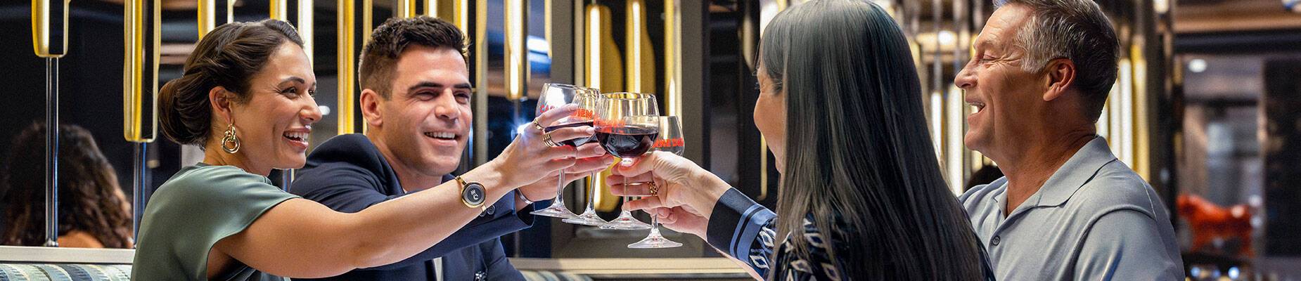 A group of friends cheering their drinks