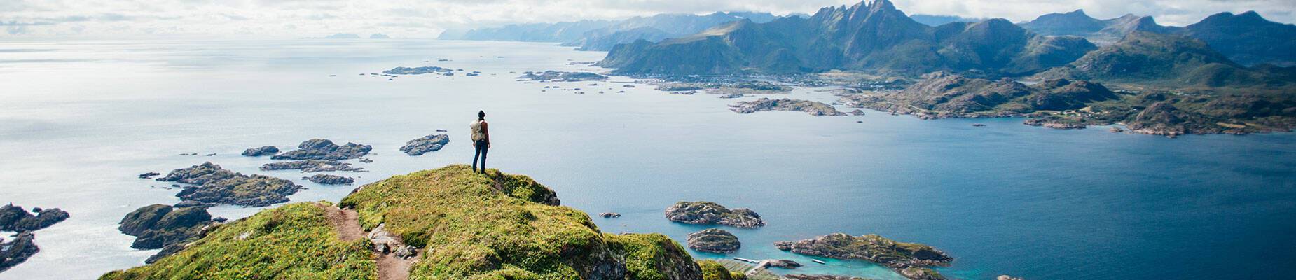 Person looking out over Norway’s landscapes