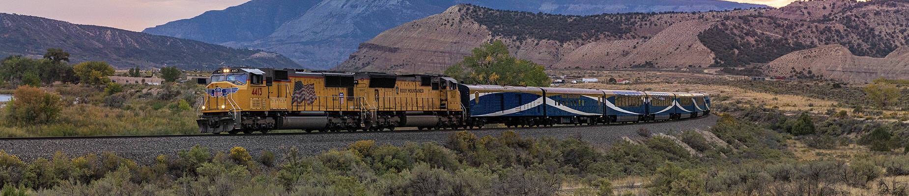 Rocky Mountaineer travelling at dusk