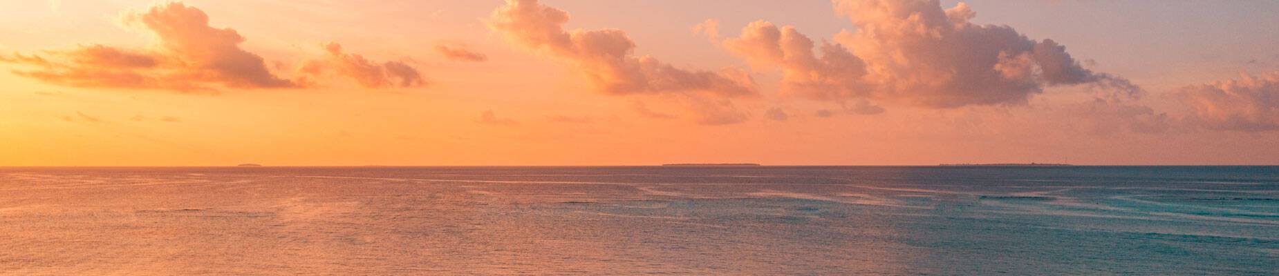 Sunset over the horizon at sea