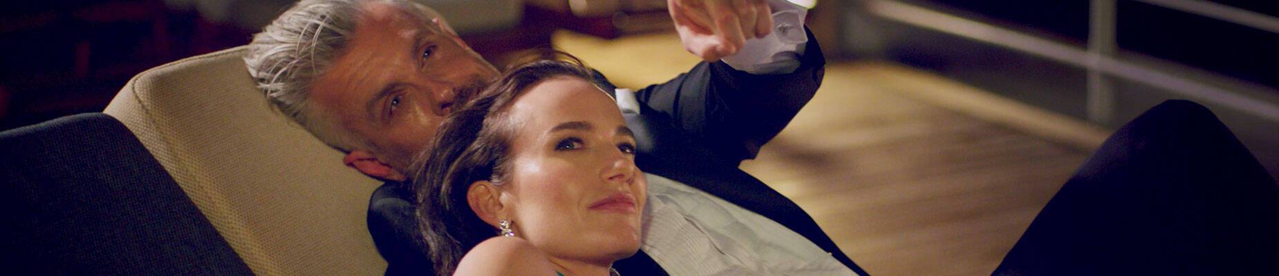 Couple stargazing on a cruise ship deck