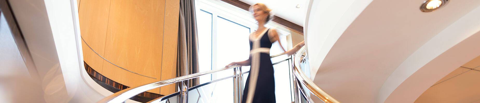 A woman walking downstairs