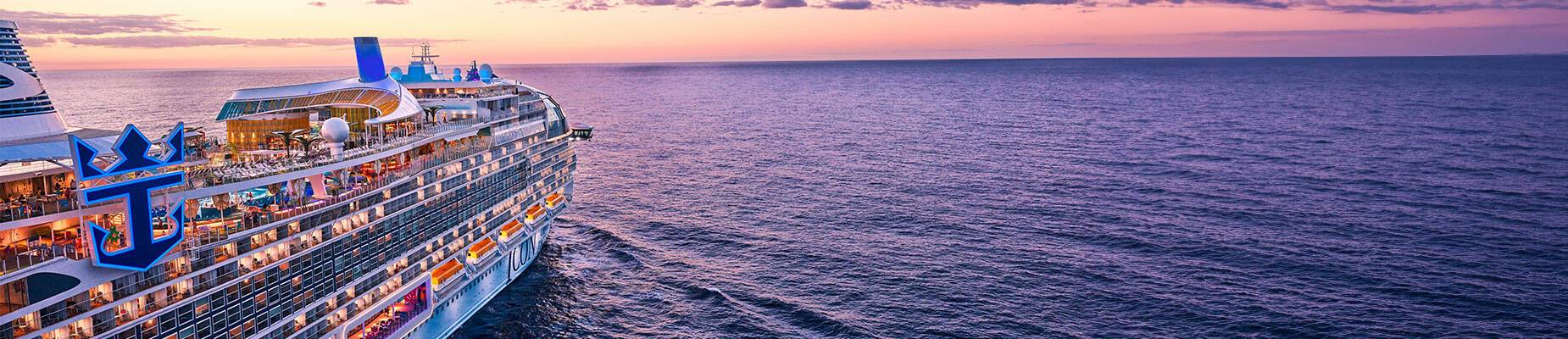 Icon of the Seas sailing towards the sunset