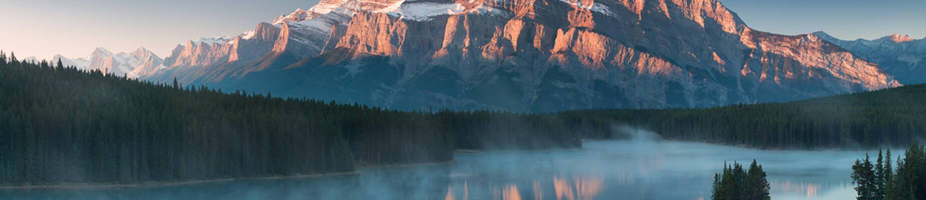 The sun setting over Lake Minnewanka