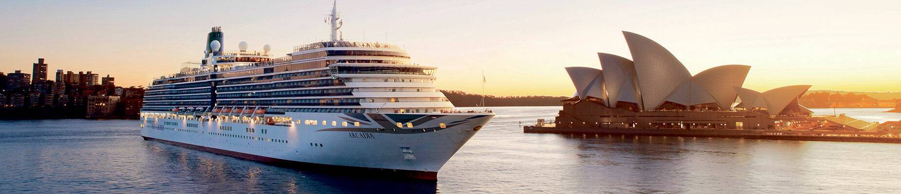 A cruise ship departing Sydney Harbour at sunset
