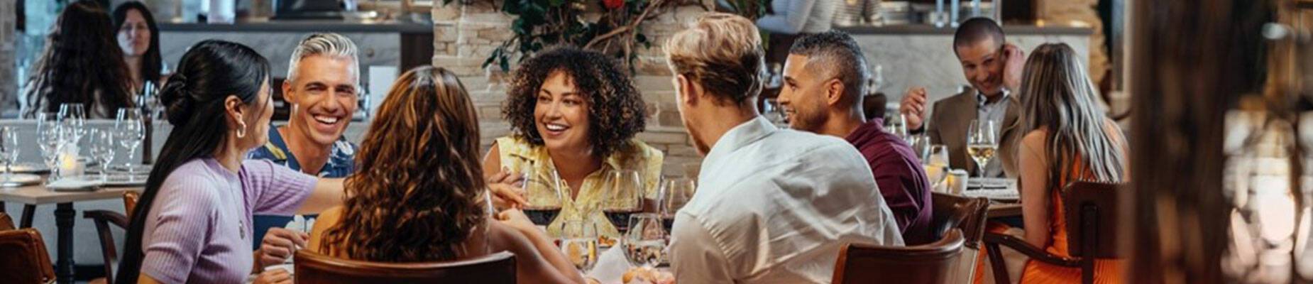 A group of friends dining in Sabatini’s Italian Trattoria