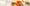 Two meals and a glass of wine on a table covered with a white linen tablecloth