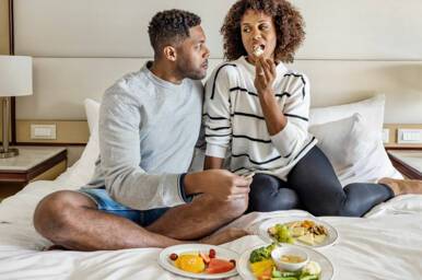 Couple enjoying Window Suite, Discovery Princess, Princess Cruises