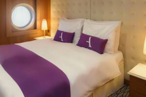De Luxe Suite Bedroom. Ambition, Ambassador Cruise Line