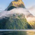 The sun setting over New Zealand's Milford Sound