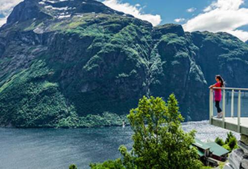Girl looking out at a fjord from Hellesylt's lookout