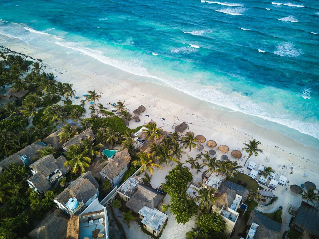 aerial view of caribbean beach front and houses