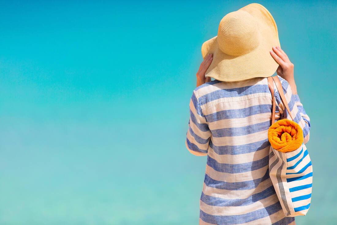 Women on the beach with hat