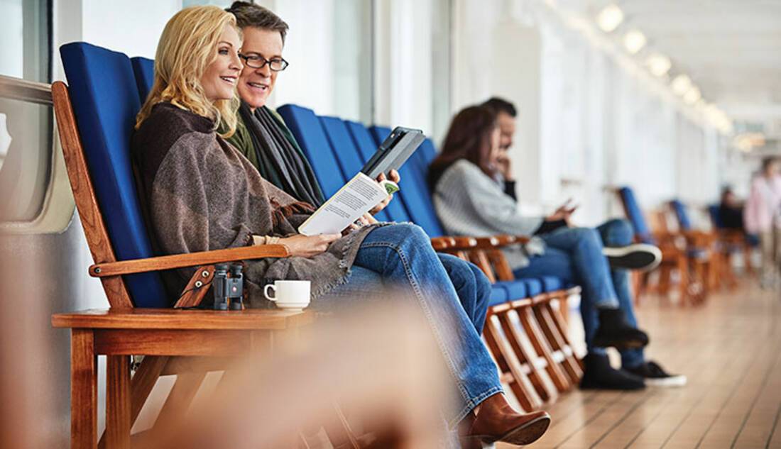Couple reading on a cruise ship