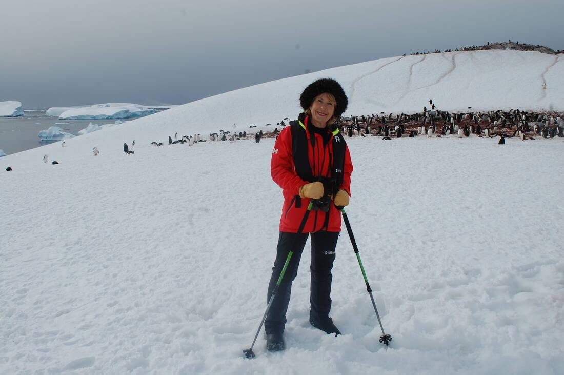 Jennie Bond with Penguins in Antarctica