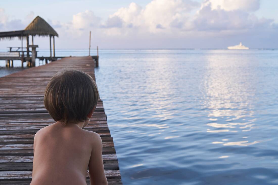 child looking at cruise ship tahiti south pacific island