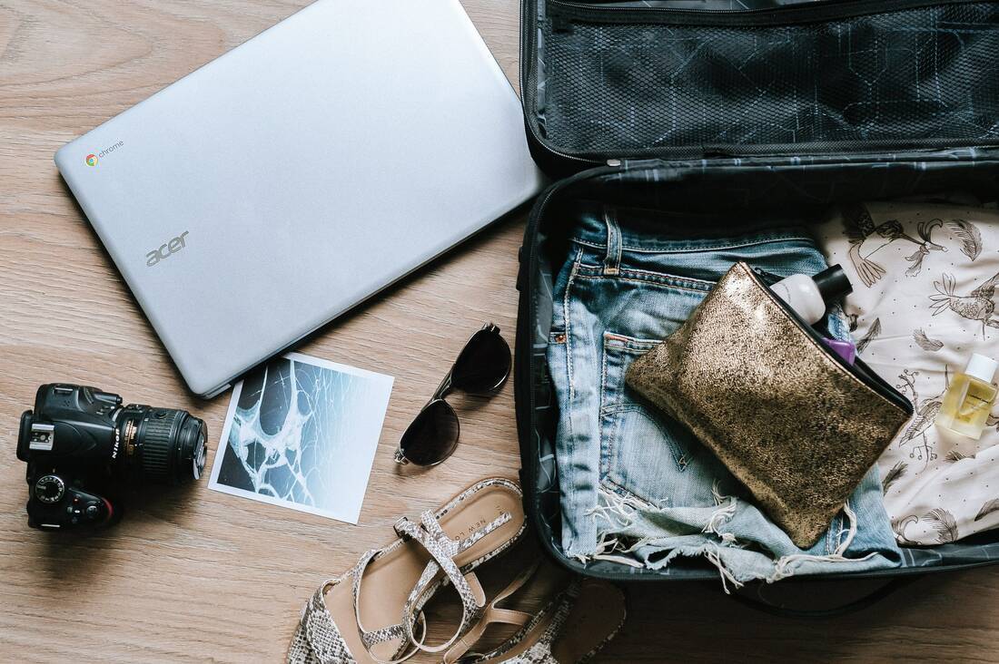 Suitcase with camera and laptop