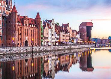 The cityscape of Gdansk reflected in the water