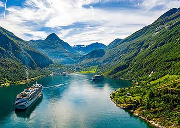 Cruise ships sailing in and out of Geirangerfjord