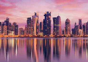 Doha's cityscape reflected in the water
