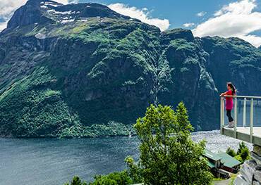 Girl looking out at a fjord from Hellesylt's lookout