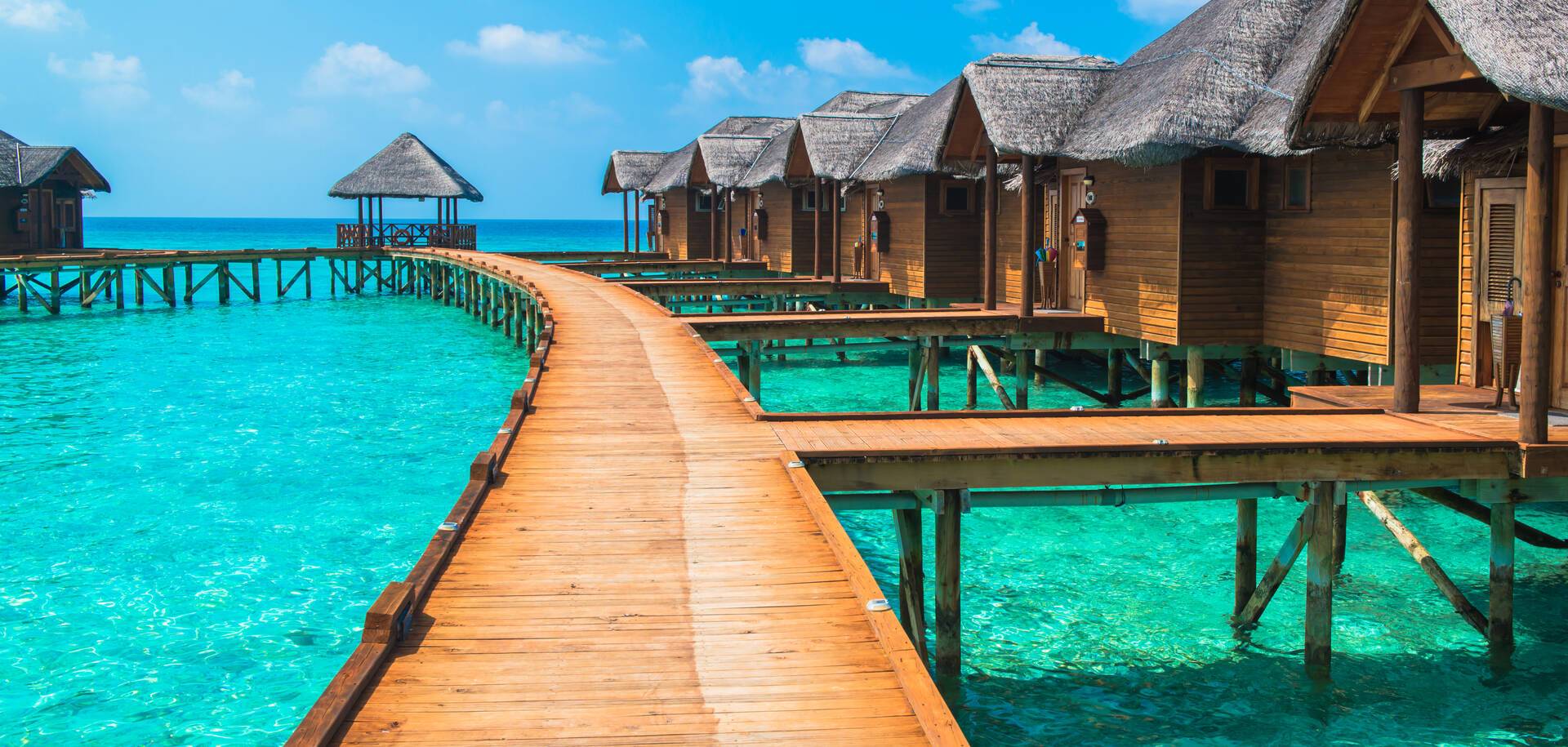 Over water bungalows with steps into amazing green lagoon