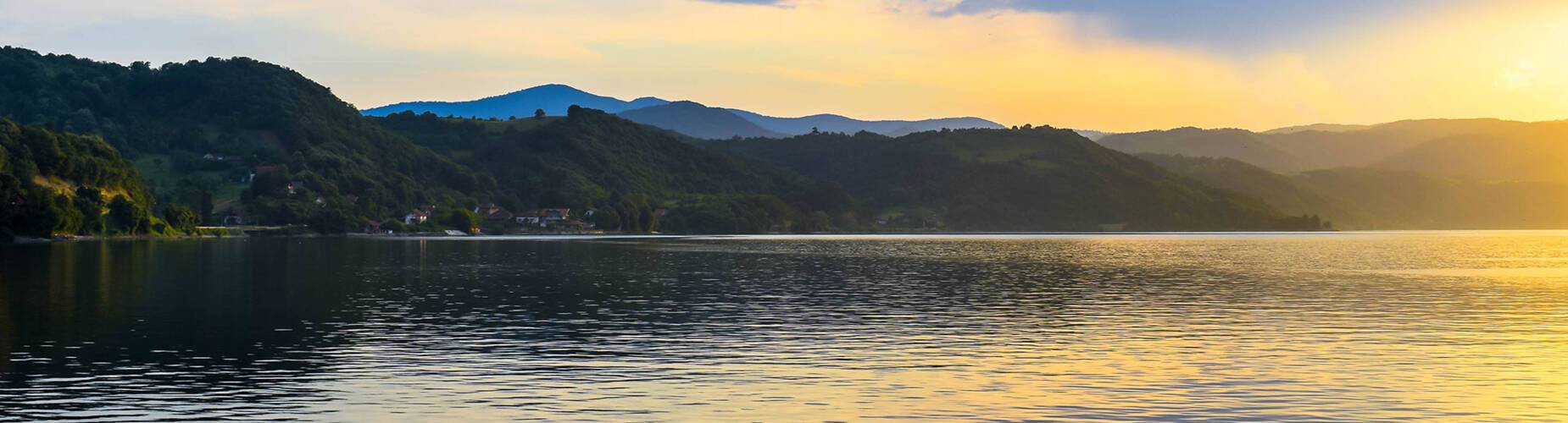 A panoramic view of Donji Milanovac at sunset