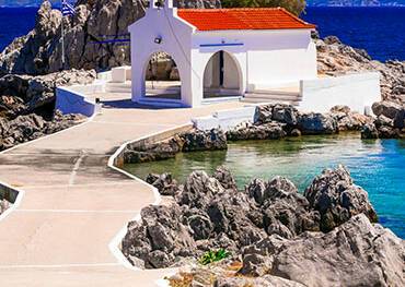 A church on the waters edge in Chios
